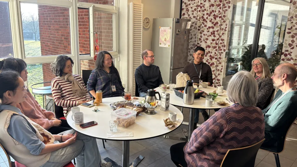 staff having fika in the kitchen. photo.