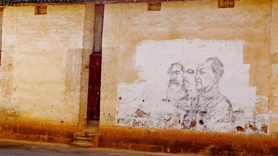 mural in China of marx, lenin, and mao