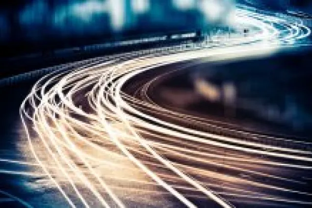 white car lights against black background