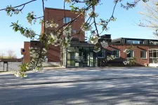 the entrance to the Centre. spring flowers in foreground. photo
