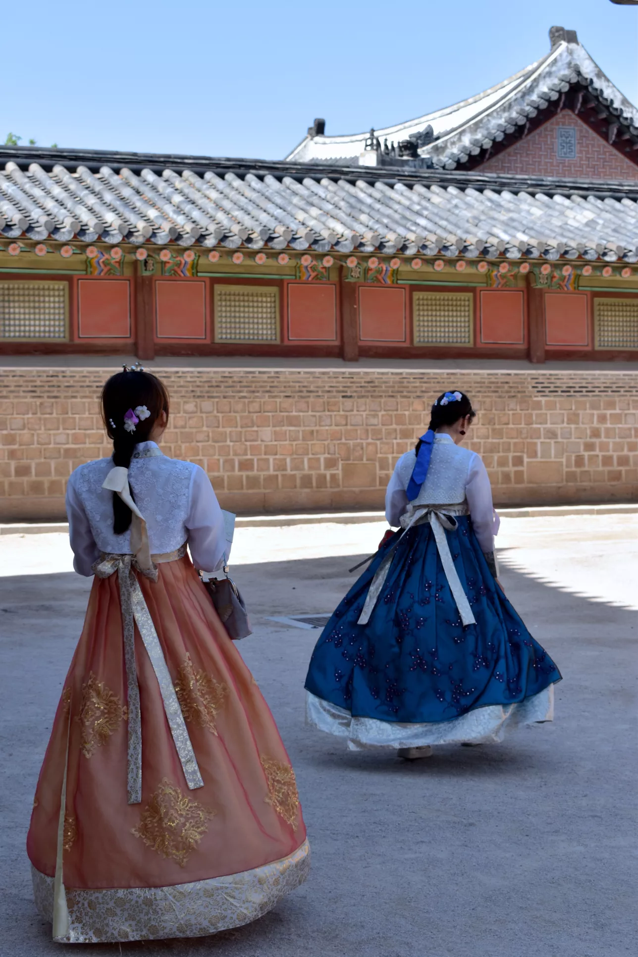 Two women in traditional dresses, Korea. Photo.