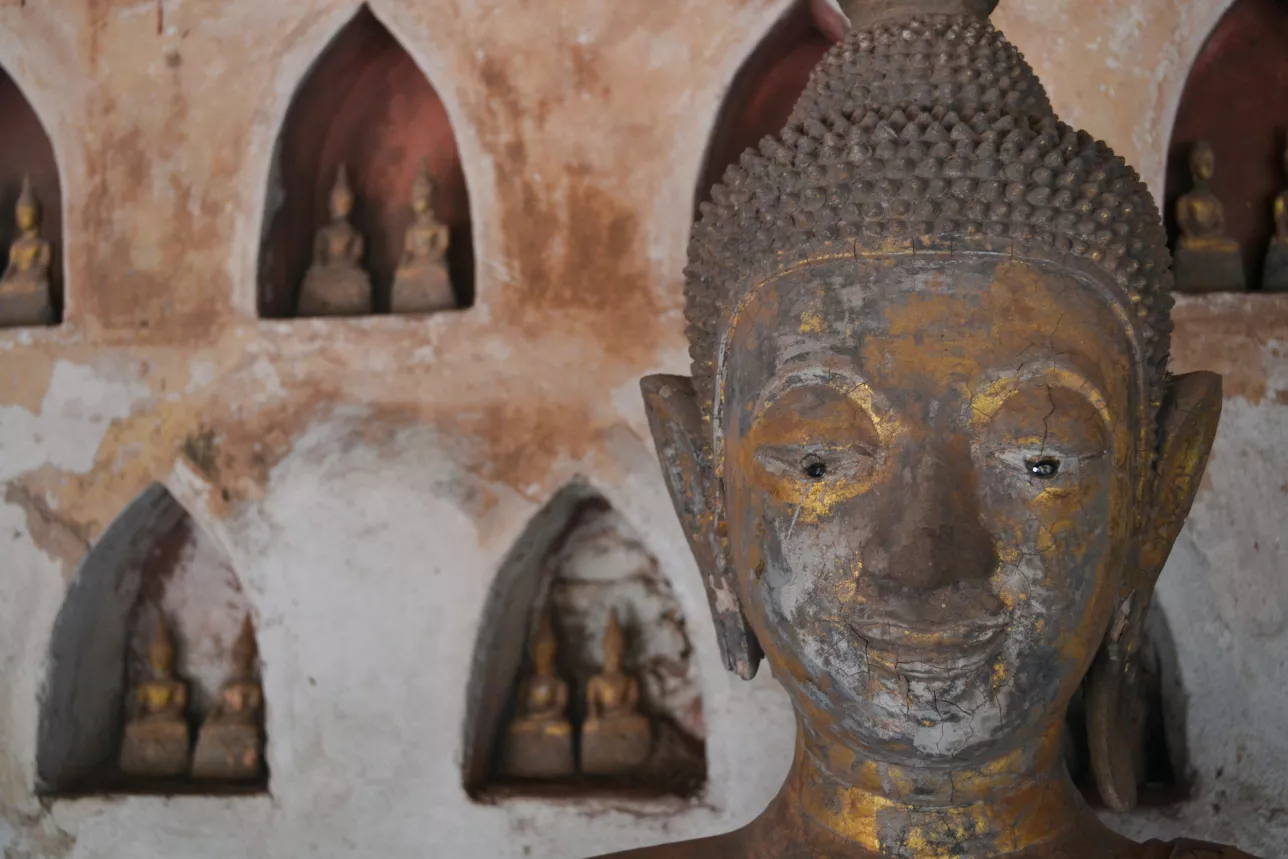 close-up of buddha head with many buddhas in background. photo